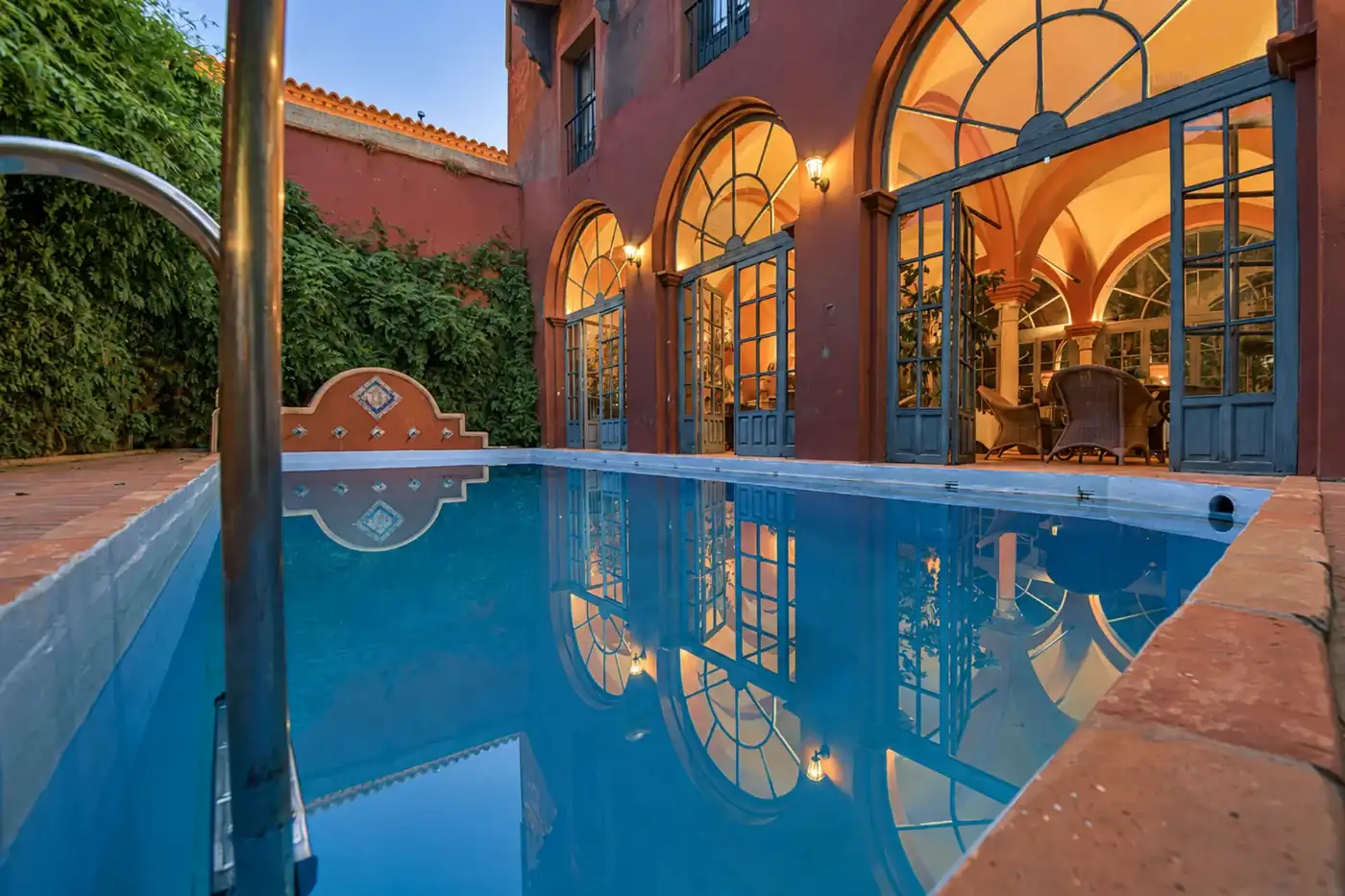 The outdoor pool and surrounding palace walls